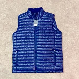 Level wear blue puffy vest.